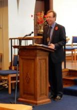The moderator at the lecturn leading worship