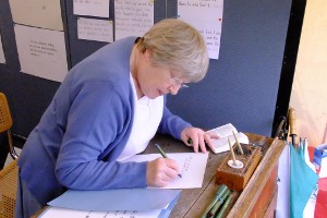 A lady copies her chosen passage